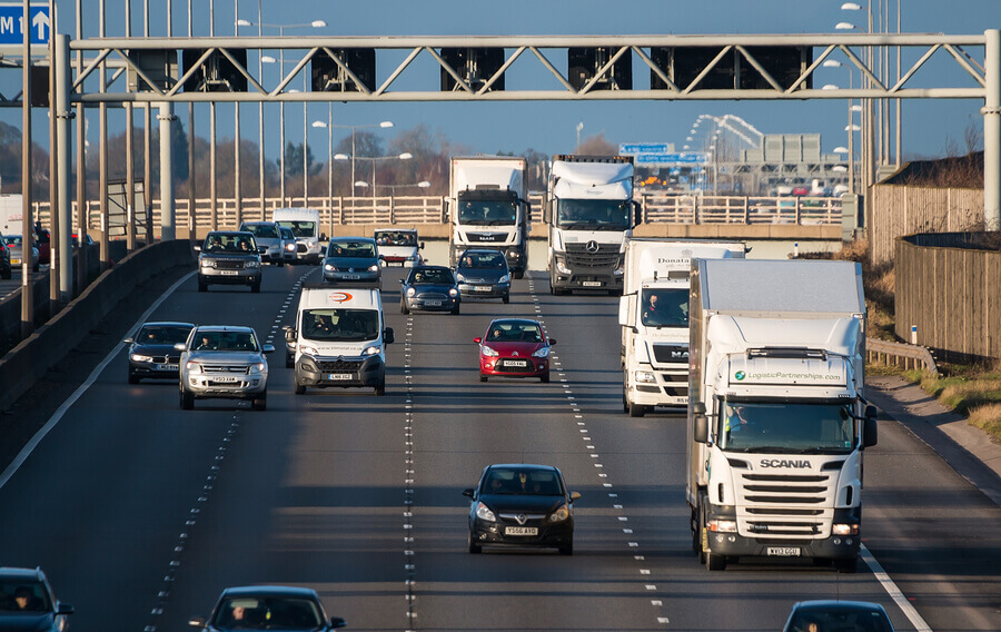 A motorway with cars and lorries driving on it